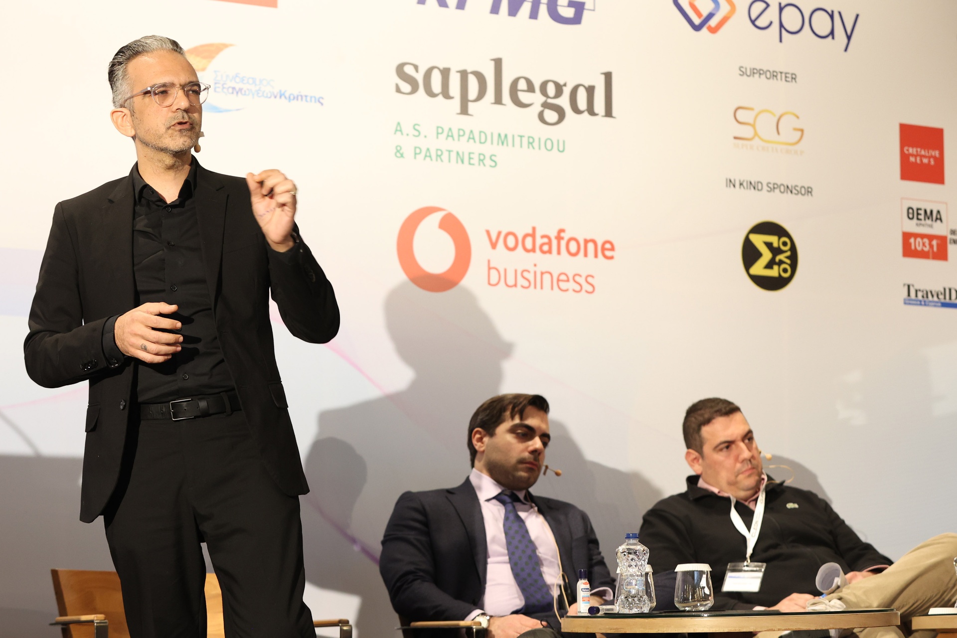 Theodore Georgedakis on stage panel discussion